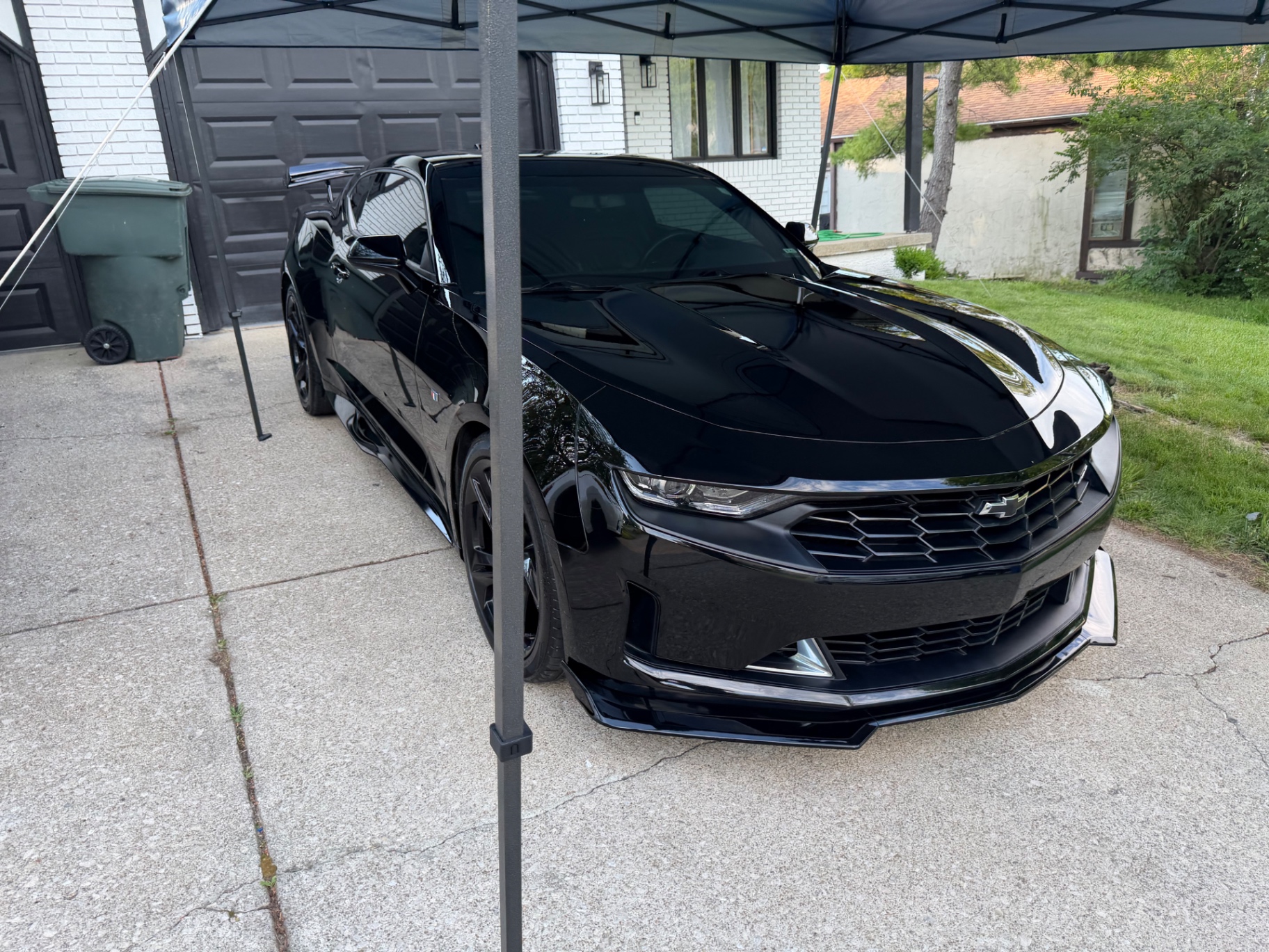 Black Camaro under Poveda mobile tent