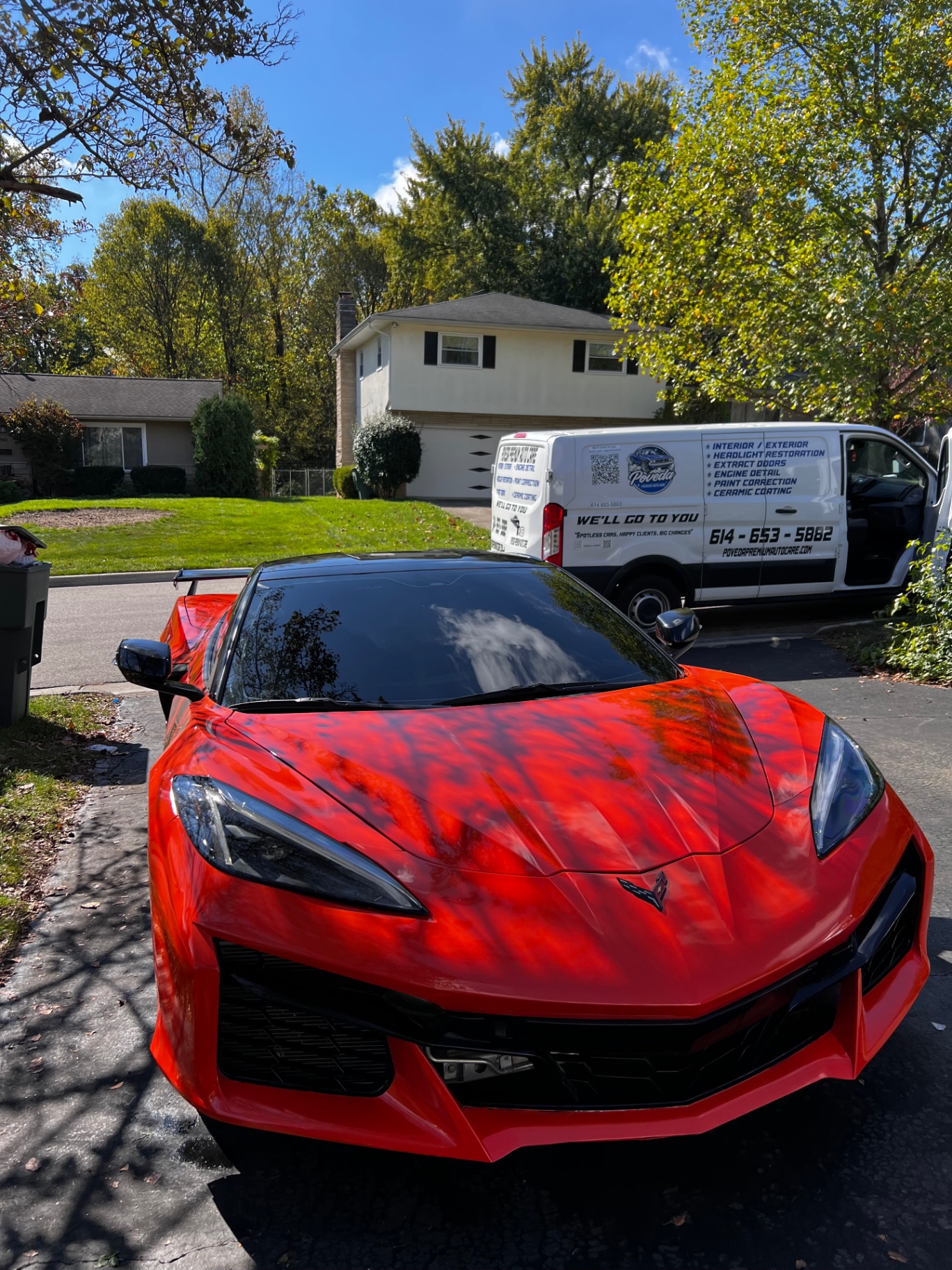 Red Corvette receiving mobile detailing from Poveda